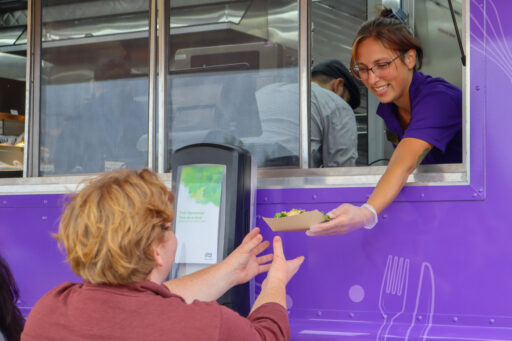 Image of food truck staff serving guest