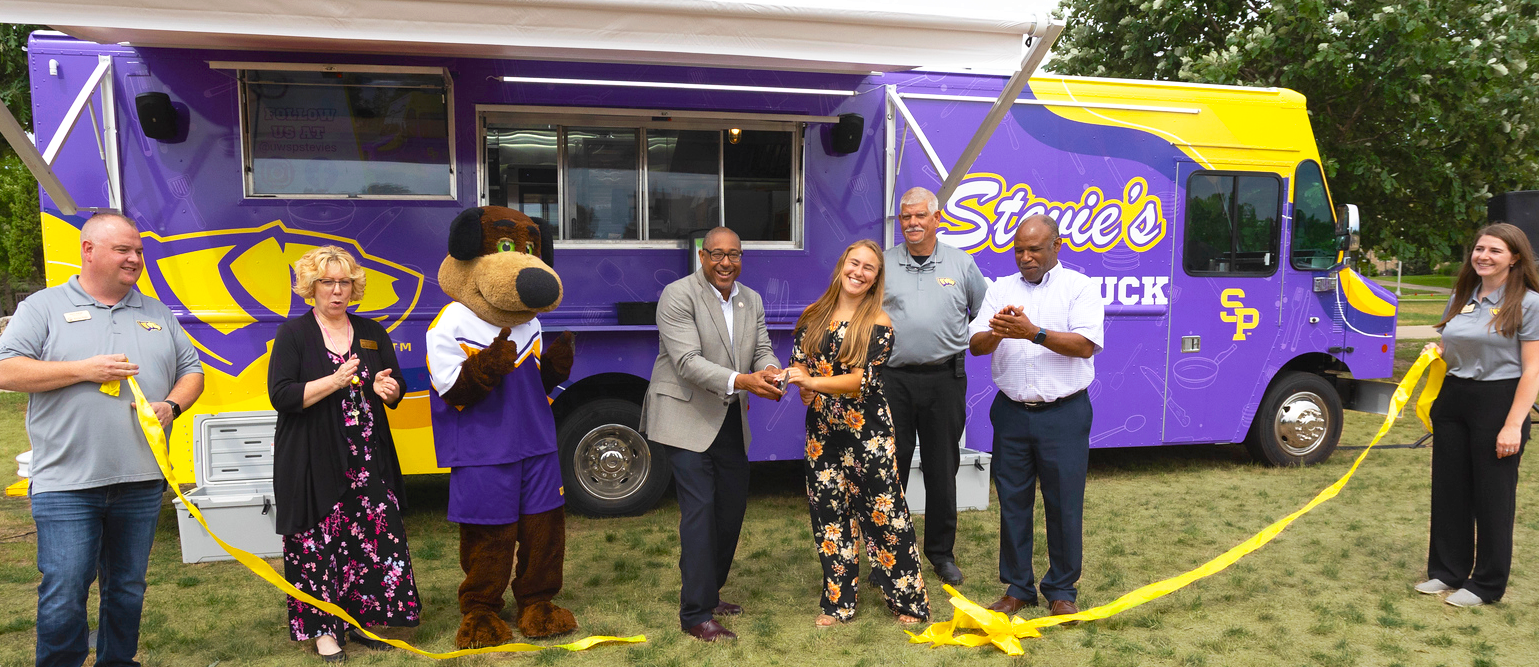 Ribbon cutting ceremony at grand opening of Stevie's Food Truck