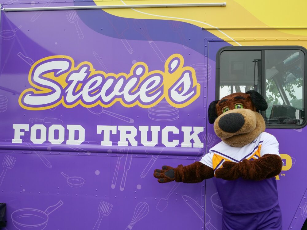 Stevie Pointer poses with the truck that bears his name.