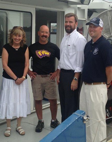 Dean Sloss pictured with, from left, CNR Dean Emeritus Christine Thomas, CNR alumnus and friend Tim Kroeff and Associate Professor of Fisheries Justin VanDeHey.