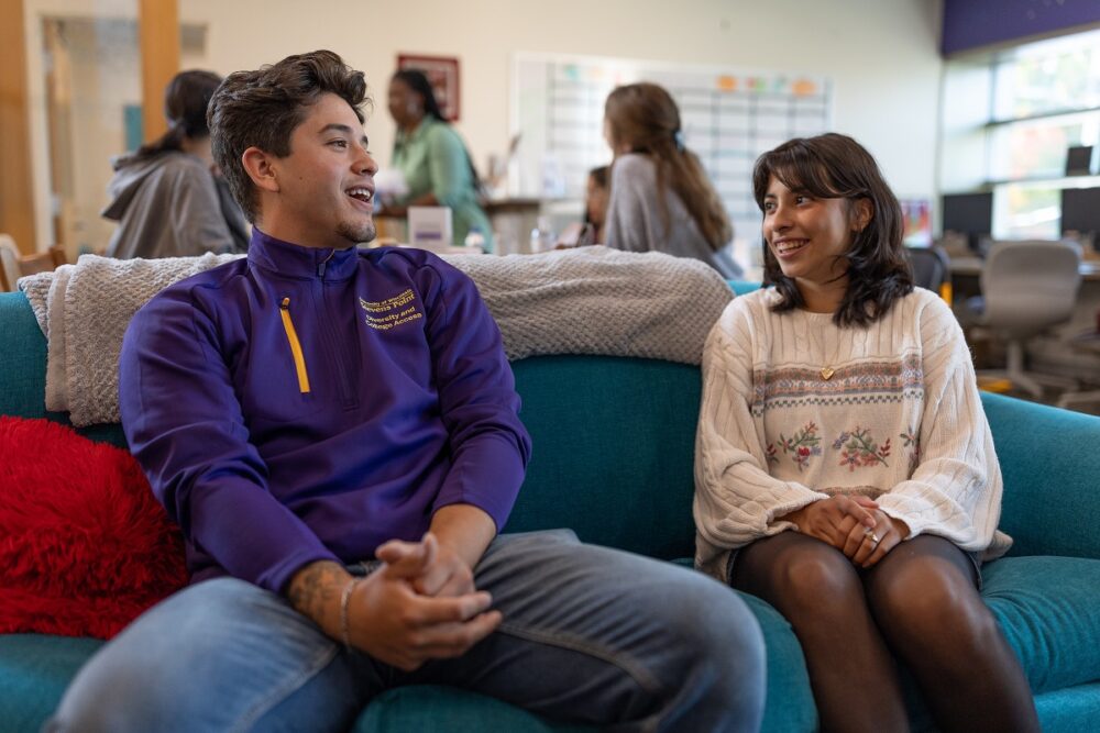 Reyes mentors fellow UW-Stevens Point student Paola Gomez as a peer success coach in the Multicultural Resource Center.