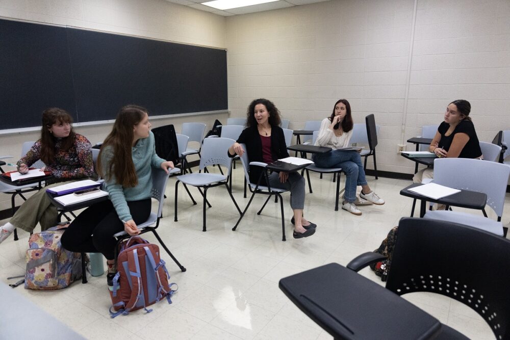 Professor Samantha Kaplan, middle, leads, small group discussion in the SUST 100: Sustainability as a Profession course, including Olivia Franklin (far right).