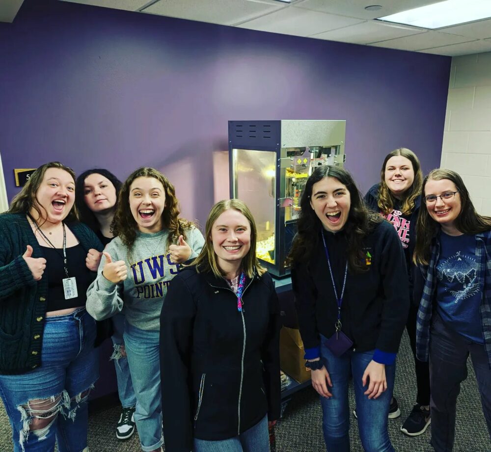 Students with popcorn machine.