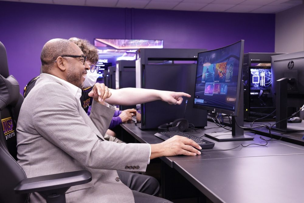 Chancellor Gibson, pictured with Esports Club President Connor Kramer, enjoyed game play within the new space.