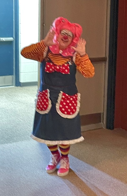 Stern-Jimenez as her clown persona, bringing smiles to senior living residents.