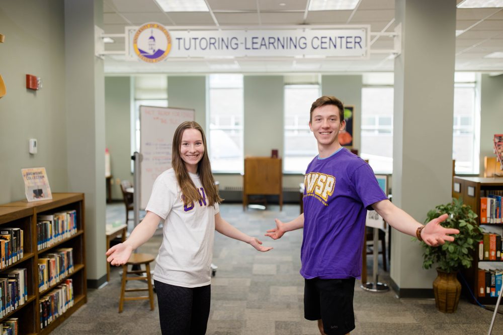 Two students standing outside the Tutoring-Learning Center