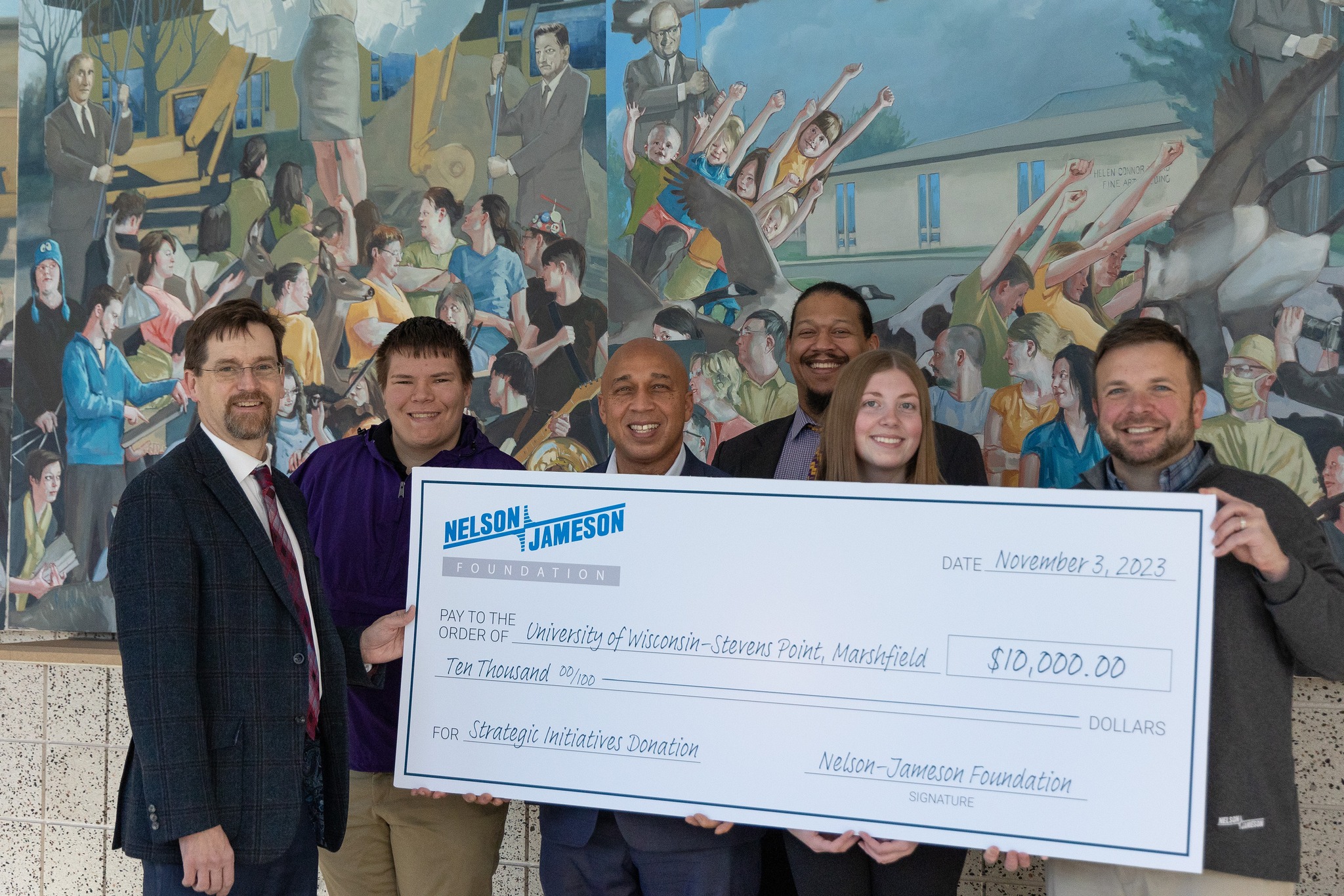The gift presentation from the Nelson-Jameson Foundation to the UWSP Foundation included, from left, UW Marshfield Foundation Chair Dr. Matt Jansen, Campus Student Government Association Vice President of Internal Affairs Jacob Stalheim, Campus Executive Anthony Andrews, UWSP Vice Chancellor for University Advancement William Broussard, Campus Student Government Association Secretary Kaelyn Schriener and Nelson-Jameson Vice President of Corporate Responsibility and Development Mathew Bartkowiak.