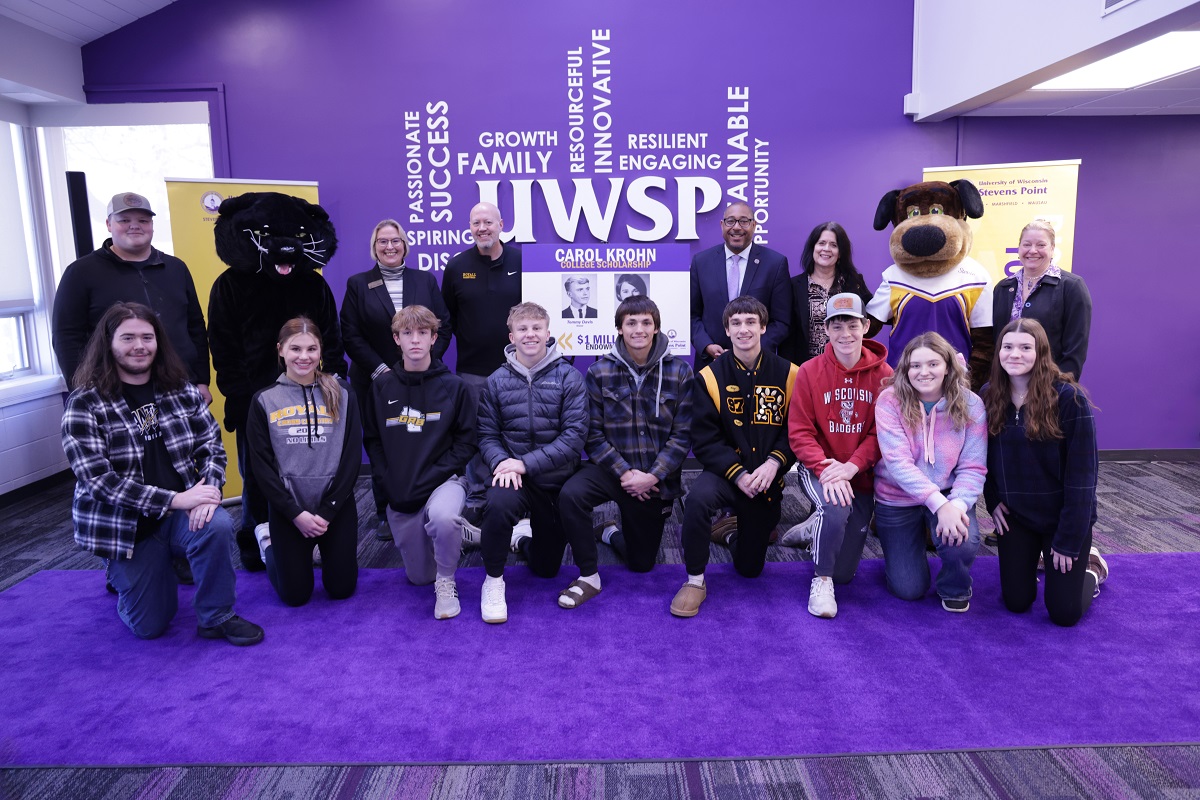 Royall High School students, principal and Panther mascot join UW-Stevens Point’s leadership and Stevie Pointer mascot at an announcement of a $1 million estate gift. The endowment will provide scholarships for qualified Royall High School graduates who attend UW-Stevens Point.