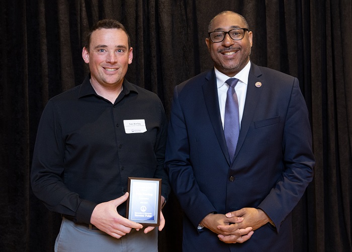 Nate Bowling, with Chancellor Tom Gibson, won a University Scholar Award at the 2023 University Awards.