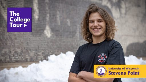 Student posing in front of UWSP mural