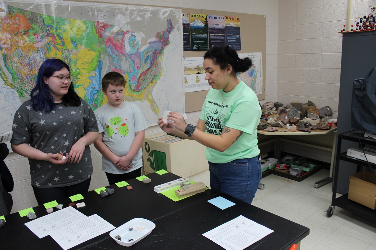 Children hold rock and mineral specimens as part of the UWSP Collection Crawl in 2024.