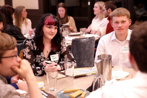 UW-Stevens Point students Avery Koepsell and David Kaminski, part of a team coached by Associate Professor of Business Reed Stratton, listen to a discussion at the kick-off meeting for the inaugural Case in Point Business Solutions Competition.
