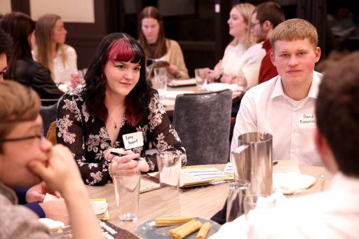 UW-Stevens Point students Avery Koepsell and David Kaminski, part of a team coached by Associate Professor of Business Reed Stratton, listen to a discussion at the kick-off meeting for the inaugural Case in Point Business Solutions Competition.