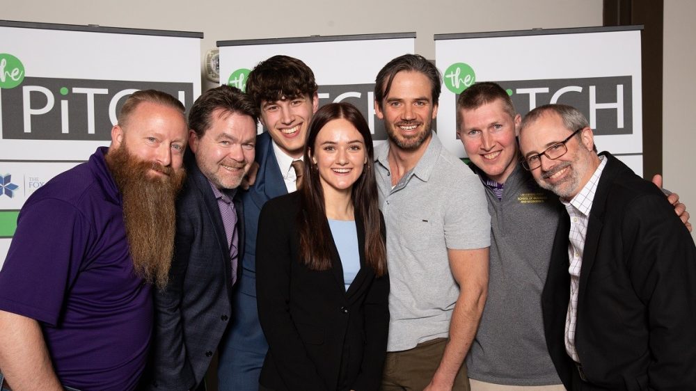 Pictured at The Pitch competition are Patrick Gatterman, SBDC director; Timothy McKeough, business consultant and coach; Alex Suscha, business administration student and fellow competitor; Densow; Jackson Burgau, SBDC business consultant; Reed Stratton, associate professor of business; and Kevin Neuman, head of Sentry School of Business and Economics.