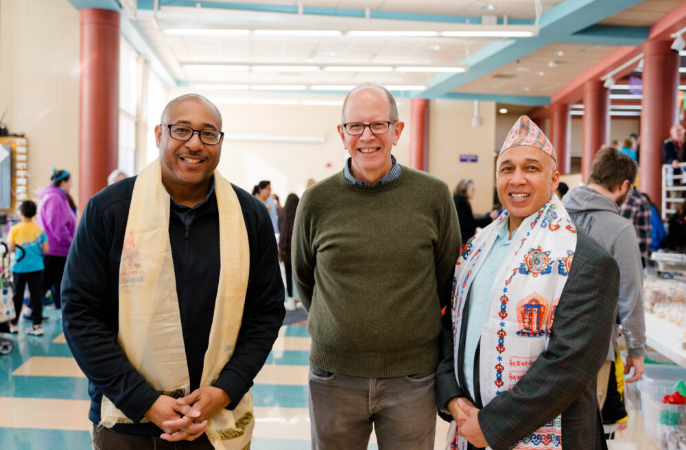 Chancellor Thomas Gibson and Marshfield Campus Executive Anthony Andrews and an attendee at the Marshfield Area Cultural Fair