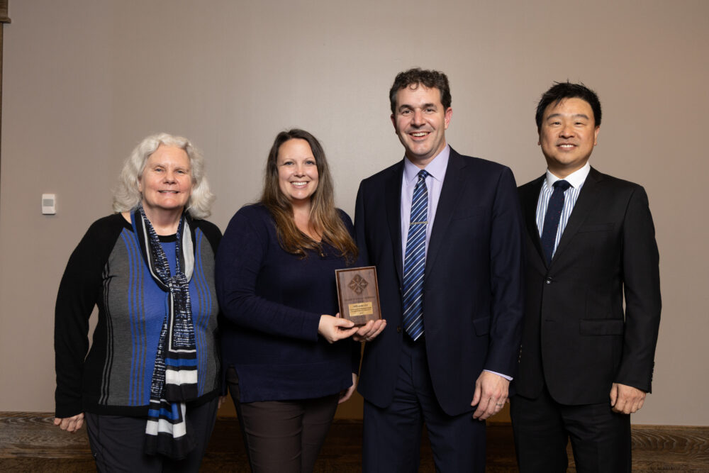 Don and Kelly Guay except the Paper Industry Leadership Award for Ahlstom Oyj with Professor Biasca and Gong.