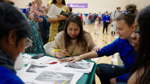 An attendee receiving a henna tattoo at the Marshfield Area Cultural Fair