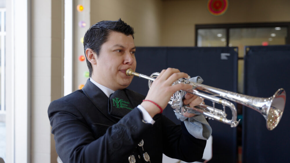 A person playing the trumpet at the Marshfield Area Cultural Fair