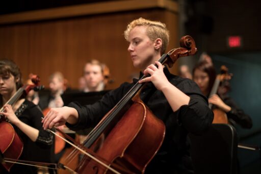 A student playing a cello