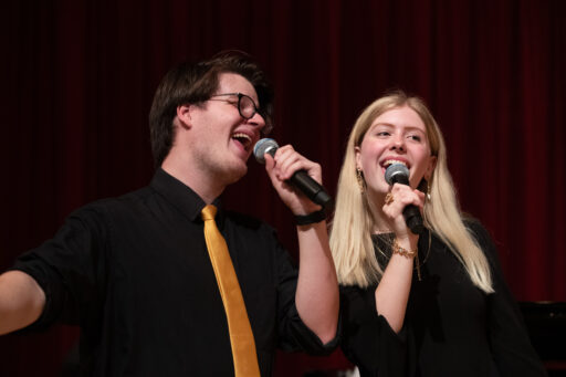 2 students singing