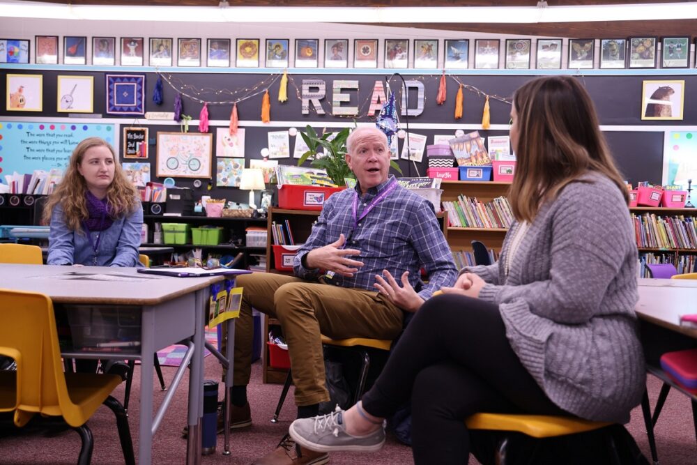Perry Cook, working in a classroom with elementary education students, has taught and led programs at UW-Stevens Point for more than 30 years.