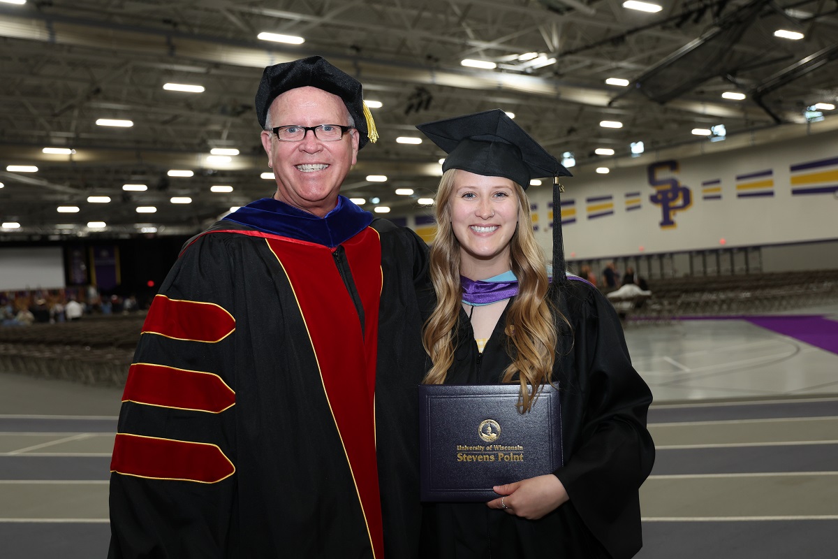 Perry and Stephanie Cook at the May 2025 commencement ceremony, where Perry was able to present his daughter with her diploma.