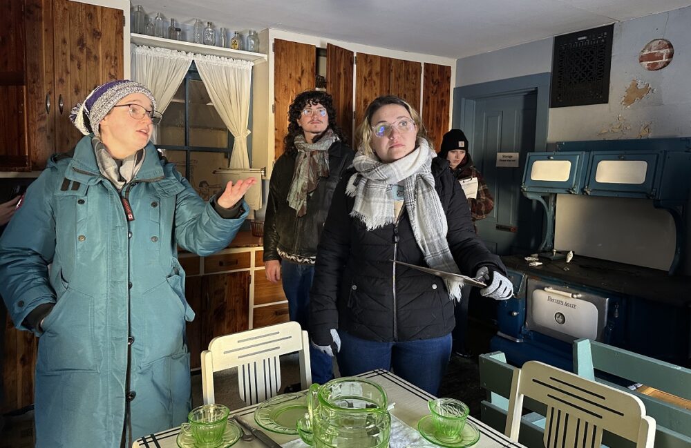 Students take a look at the historic perspectives offered at Heritage Park as part of their course project.
