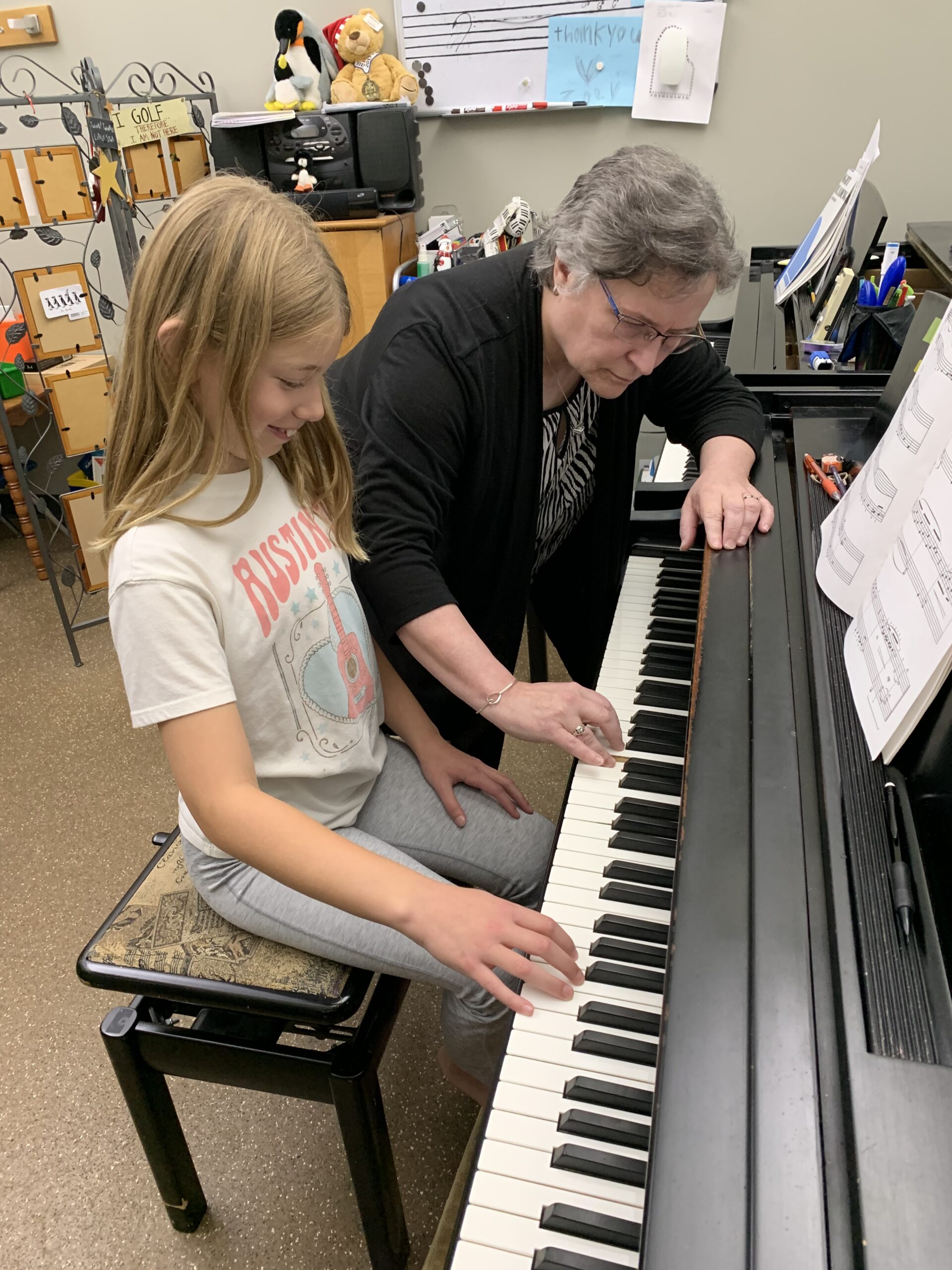 Ann Marie Novak teaching a child piano